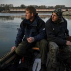 Hungarian fishermen Attila Solyomvari, left, and Tibor Osze, right, look at the River Danube near Gyor. The mighty Danube apparently absorbed Hungary's massive red sludge spill with little immediate damage Friday but laboratory tests heightened concerns about possible longer-term harm caused by toxic heavy metals in the slurry.