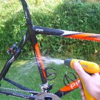 Now use a hose or a few buckets of clean water to rinse the bike.