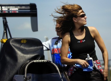 Top Fuel points leader Melanie Troxel stands next to her car
