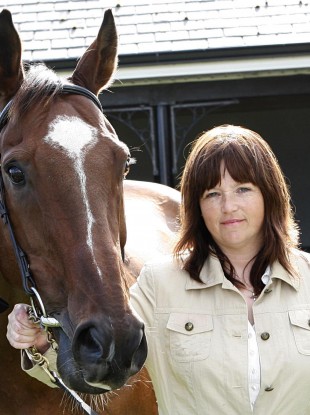 Sharon Newsome and rescued horse Moscow