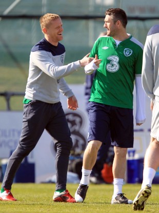 Damien Duff and Robbie Keane share a joke at Gannon Park yesterday.