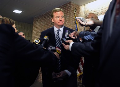 NFL Commissioner Roger Goodell talks with reporters.