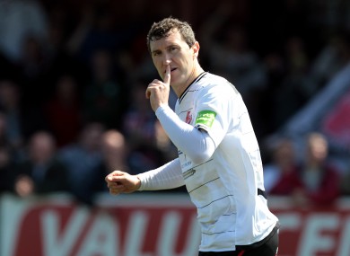 Dundalk's Jason Byrne gestures to Shamrock Rovers fans after scoring from the penalty spot on Monday.