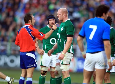 Romain Poite lectures Paul O'Connell during Ireland's Six Nations clash with Italy.