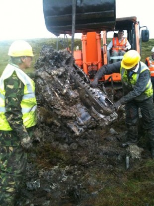 The engine of the Spitfire is brought to the surface