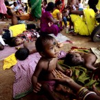 An Indian mother feeds her child in the eastern city of Bhubaneswar (AP Photo/ Biswaranjan Rout)