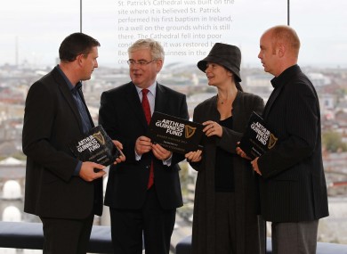 Tánaiste Eamon Gilmore with three of the Arthur Guinness Fund recipients at today's event at the Guinness Storehouse. 