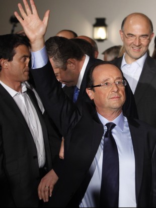 Francois Hollande waves after winning the Socialist Party's primary vote.