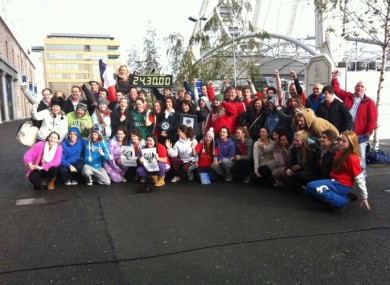 The group of over 50 students, broadcasters and comedians celebrate after being confirmed as Guinness World Record holders for their 1470-minute stint on a Big Wheel.