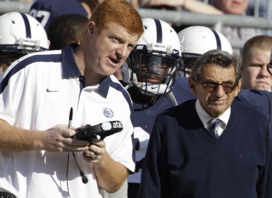 Penn St assistant football coach Mike McQueary, left, talks with then head coach Joe Paterno.