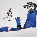 Two-year-old Ethan Woodley enjoys playing in the snow in Whitburn, Scotland, following fresh snow falls overnight.