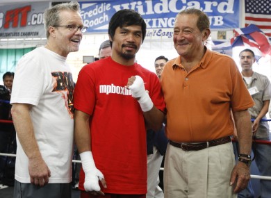 Pacquiao with trainer Freddy Roache (left) and promoter Bob Arum (right)