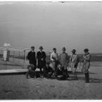 Group portrait of Orville Wright with brother Lorin, nephew Horace and journalists in front of glider at Kill Devil Hill, Kitty Hawk. (Library of Congress, Prints & Photographs Division)