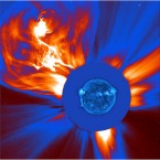 A large coronal mass ejection recorded in January 2002. The blue ultraviolent image of the sun was superimposed over the image of the particle blast for scale. (NASA/the Solar Dynamics Observatory) 