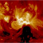 Solar particles are captured spiralling along magnetic field lines. (NASA/the Solar Dynamics Observatory) 