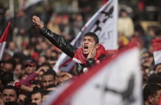 An Egyptian soccer fan shouts anti-ruling military council slogans during a protest at Sphinx square in Cairo today.