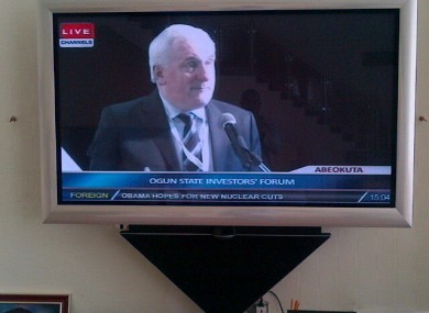 Ahern, pictured on TV, speaking at the investors' forum yesterday.