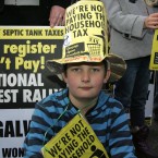 Patrick Doorhy (8) from Galway outside the Convention Center in Dublin, protesting over the household charge. Photo: Sam Boal/Photocall Ireland