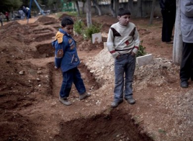 Graves are dug for Free Syrian Army fighters in Idlib. Activists say they can't be buried in graveyards as these are targets of government forces.