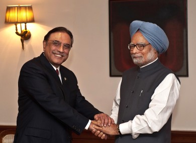 Zadari shakes hands with Singh at the prime minister's residence in New Delhi today.