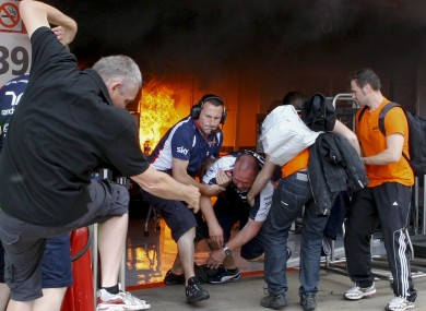 Williams mechanics rush to safety.