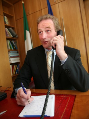 Enda Kenny on the phone (File photo)
