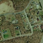 A bird's-eye vie shows very few remaining buildings and swathes of brown vegetation. (Image: Google Earth)