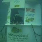 At the world’s first underwater post office, 150 feet out and nine feet down off marine sanctuary Hideaway Island, it’s not slow-moving lines of humans you have to contend with but schools of shimmering fish.
Cyclone Jasmine damaged the structure in February 2012, so for now scuba-gear-clad mailmen have been replaced by an unmanned yellow post box; about  gets you a waterproof postcard mailed anywhere in the world. 

<a href=