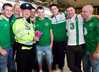 A Dublin Airport police officer with the priceless tickets and Damian's friends before they flew out to Poland earlier this evening.
