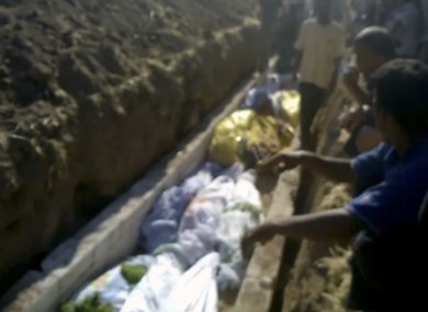 Image from amateur video purports to show victims of the Treimsa shelling being buried.