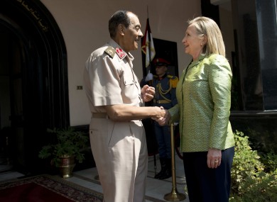 Field Marshal Hussein Tantawi, left, greets US Secretary of State Hillary Rodham Clinton before a meeting at the Ministry of Defense