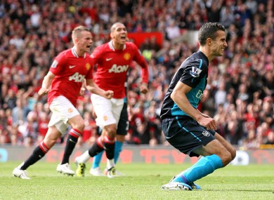 Van Persie reacts to his penalty miss against United last season.