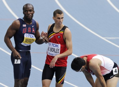 Merrit shakes hands with Kevin Borlee after a heat in Daegu.