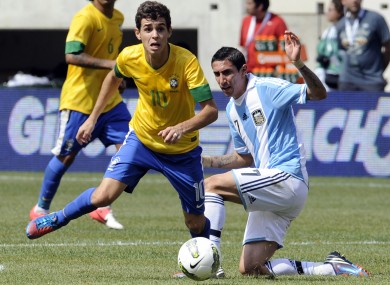 Oscar skips by Argentina's Angel Di Maria.