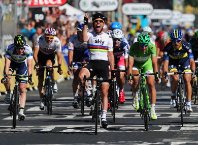 Cavendish crosses the line on the Champs Elysee yesterday.