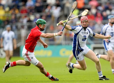 Brian Murphy chases down Waterford's John Mullane.