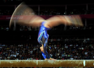 Italy's Vanessa Ferrari competes on the beam during the Artistic Gymnastics team qualification.