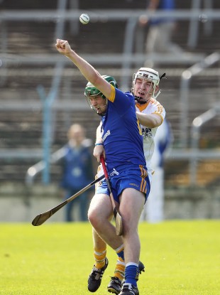Antrim's Conal Morgan and Cathal McInerney of Clare battle for possession in their U21 All-Ireland semi-final clash.