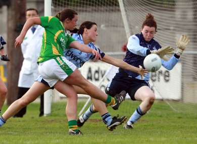 Deirdre Corridon of Kerry tries a shot on goal as Joanne O'Sullivan and Cliodhna Clarke of Dublin close in.