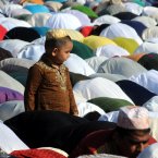 Muslims pray during Eid al-Fitr prayer, which marks the end of the holy month of Ramadan, in Palermo, Italy. Muslims around the world celebrate the Eid al-Fitr, the feast that marks the end of the holy fasting month of Ramadan. (AP Photo/Alessandro Fucarini)