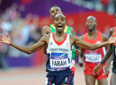 An ecstatic Farah crosses the line.