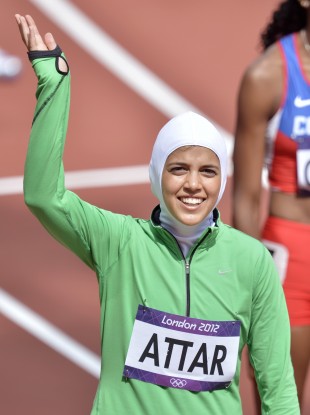 Saudi Arabia's Sarah Attar waves before competing in a women's 800-metre heat.