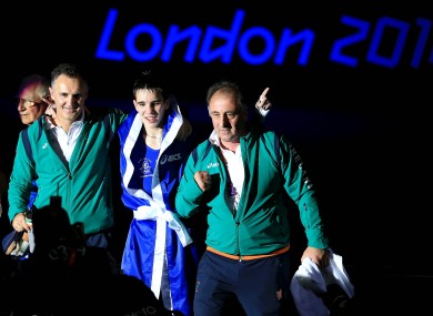 Coaches Billy Walsh, left, and Zaur Antia, right, with Michael Conlan after he secured Olympic bronze with a win against Nordine Oubaali.