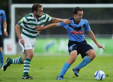 UCD's Robbie Benson and Stephen Rice of Shamrock Rovers.