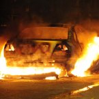 A car burns in Toxteth on Merseyside after disturbances spread to Liverpool from London.