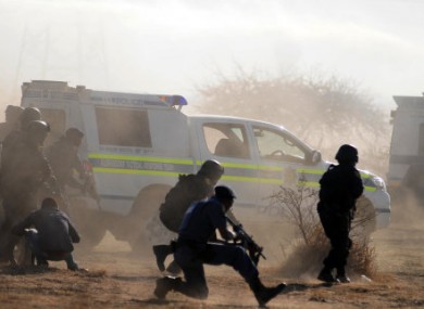 South African police opening fire during the strike confrontation on 16 August.