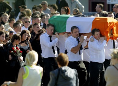 Alan Ryan's coffin is carried through Donaghmede as members of his family mourn his death earlier today.