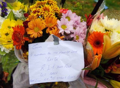 Floral tributes are left at the scene where a boy was fatally stabbed, on the Loughborough Road Estate, in Brixton, south London.