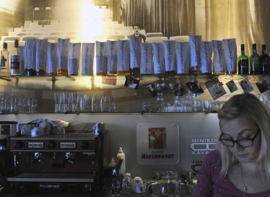 Bottles covered with paper bag with sign