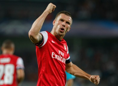 Arsenal's German forward Lukas Podolski, reacts after scoring against Montpellier.